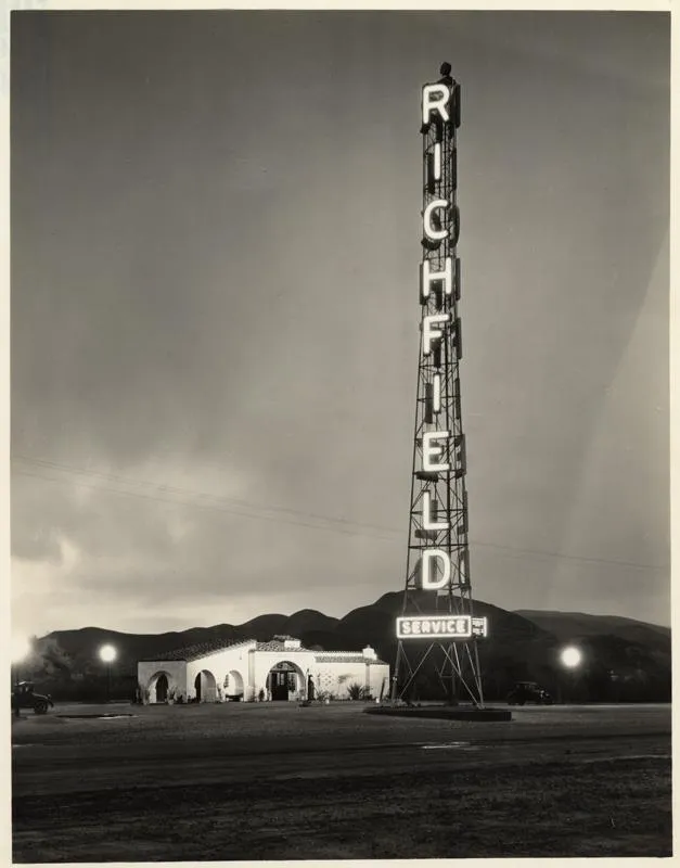 Historic night photo of the Richfield tower with its lettering lit